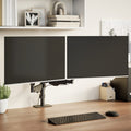 ErgoVue Span dual monitor arm holding two screens at eye level above a clear desk